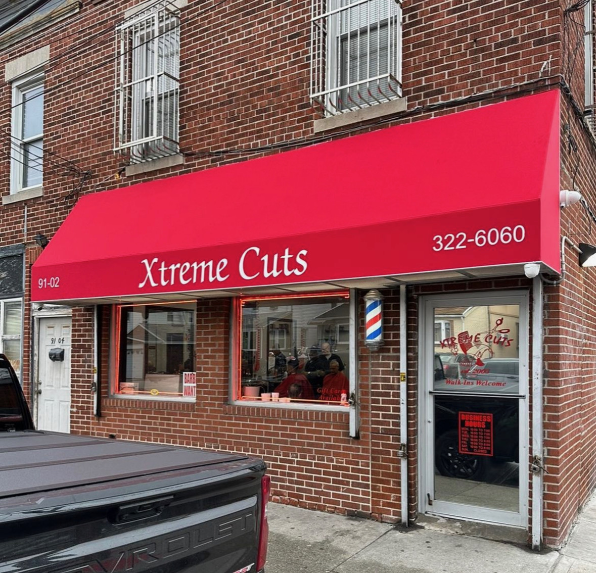 Red storefront fabric awning